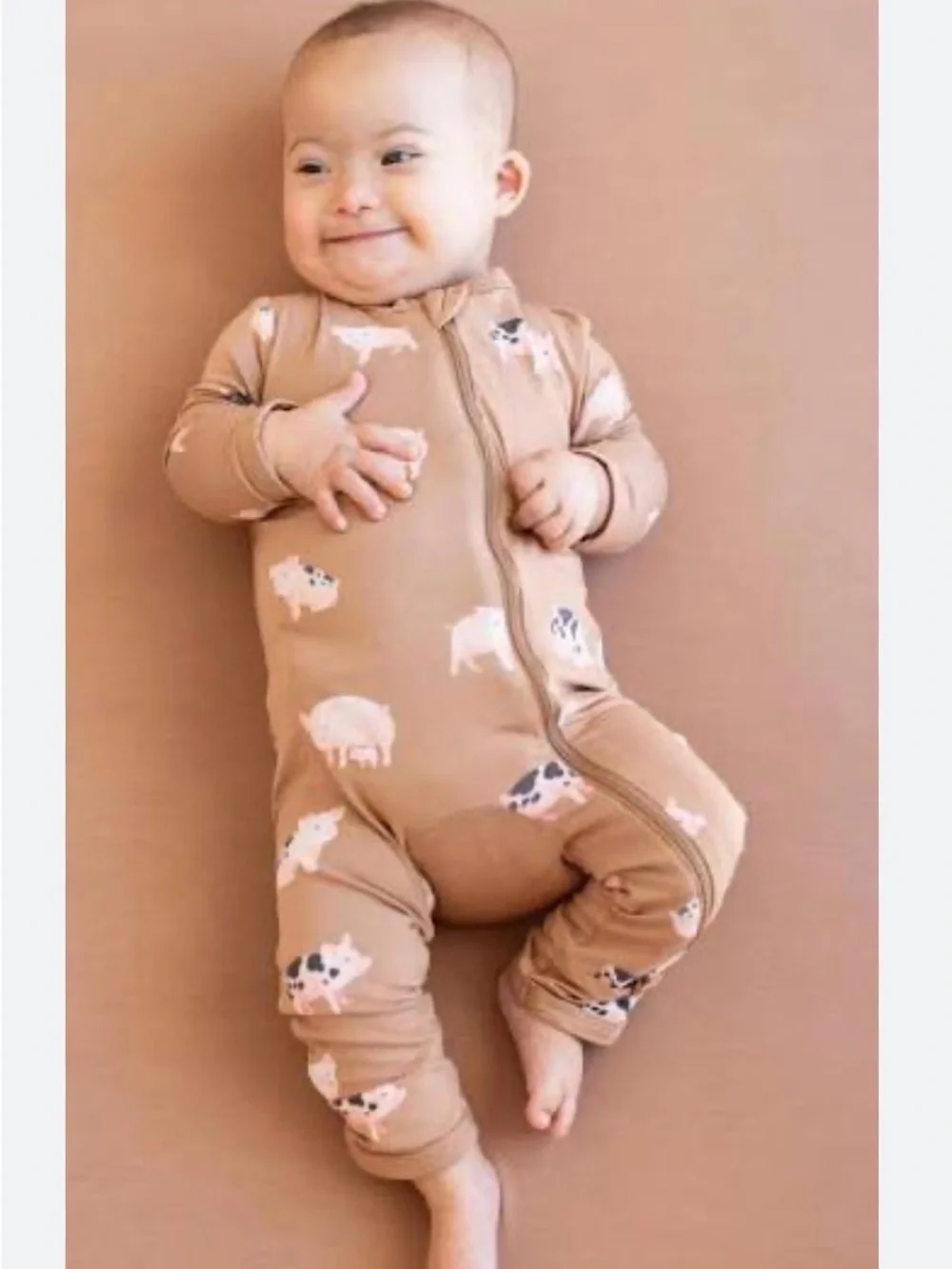 Kyte Baby Pig Zip Romper size NB. New in bag.